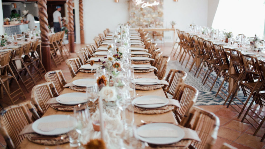 wedding reception tables set for dinner