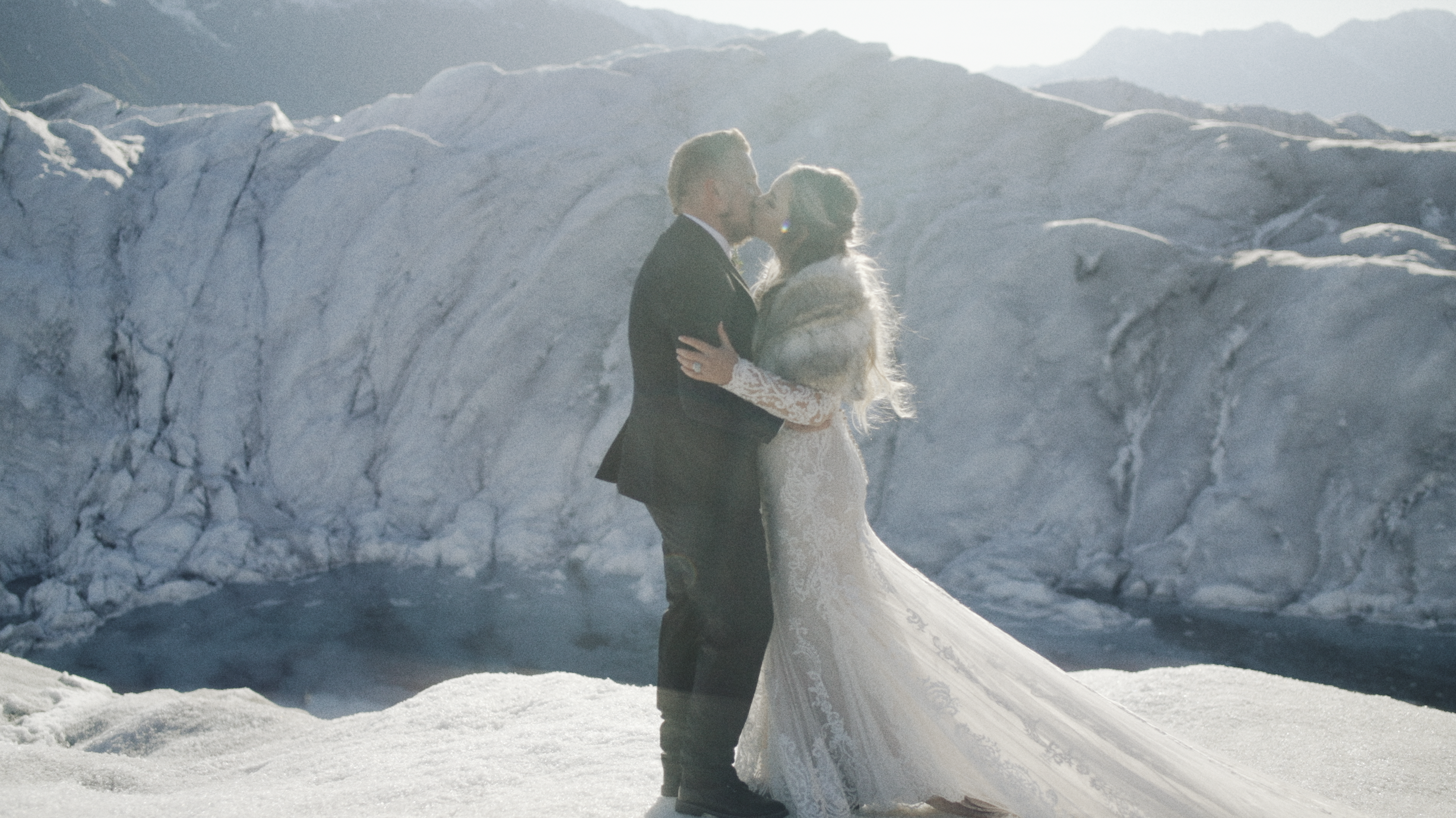 bride and groom kissing after their glacier elopement