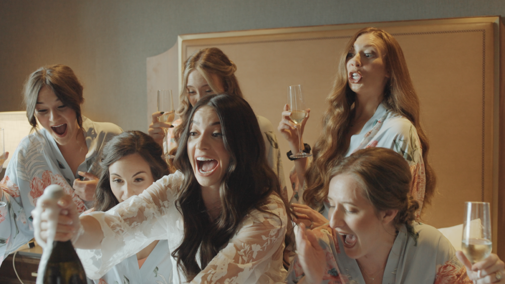 bridesmaids reaction when a bottle of champagne overflows