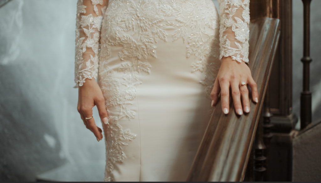 bride's hand on a banister