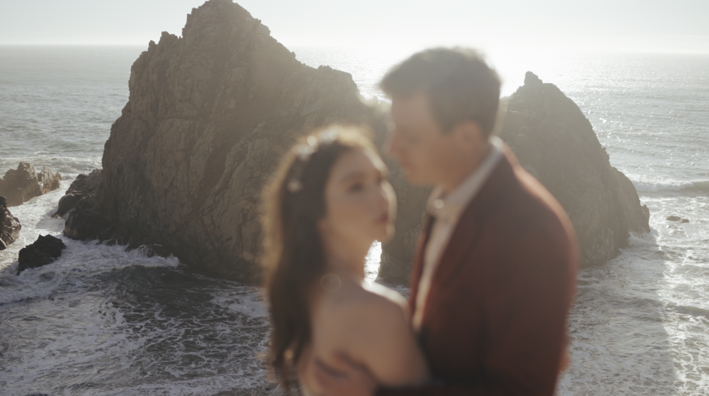 couple embracing by the Keyhole at Pfeiffer Beach